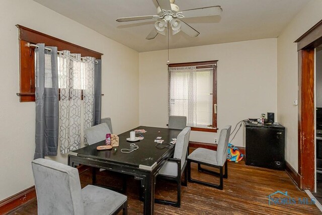 1215 Starr Ave, Toledo, OH 43605 - dining room with wood finished floors, a ceiling fan, and baseboards