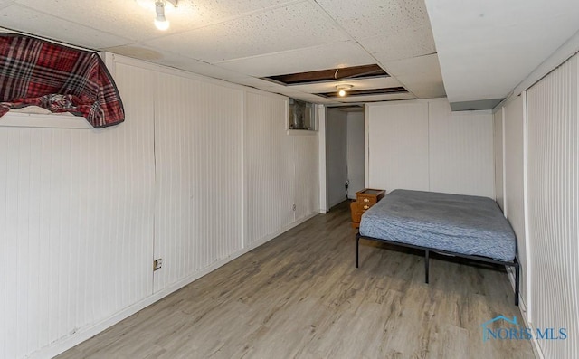 230 Heffner St, Toledo, OH 43605 - bedroom with light wood-style flooring and a decorative wall