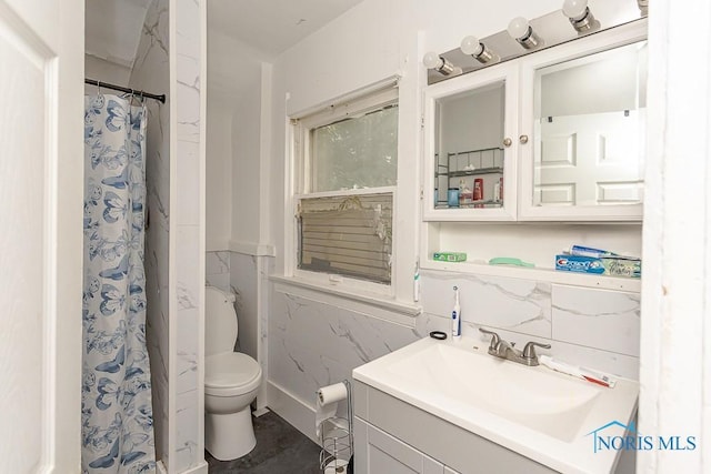 230 Heffner St, Toledo, OH 43605 - full bathroom featuring vanity, toilet, tile walls, and curtained shower