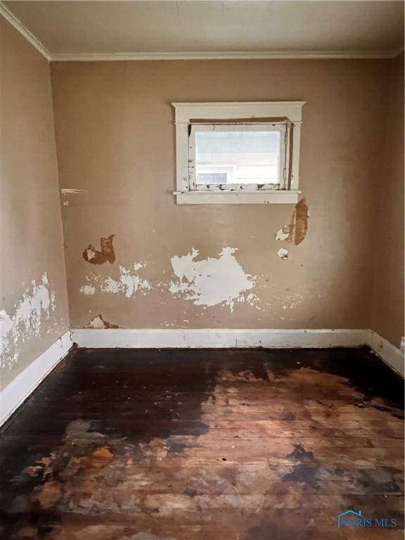 527 E Weber, Toledo, OH 43608 - empty room with baseboards, ornamental molding, and wood finished floors