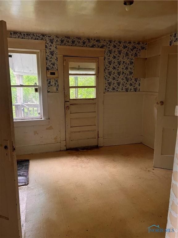 527 E Weber, Toledo, OH 43608 - doorway featuring wallpapered walls, healthy amount of natural light, and a wainscoted wall