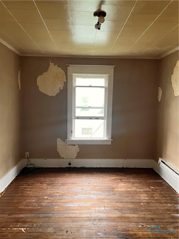 527 E Weber, Toledo, OH 43608 - spare room with hardwood / wood-style floors, crown molding, and baseboards