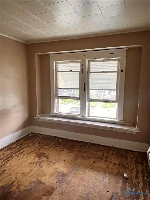 527 E Weber, Toledo, OH 43608 - empty room featuring baseboards, hardwood / wood-style flooring, and crown molding