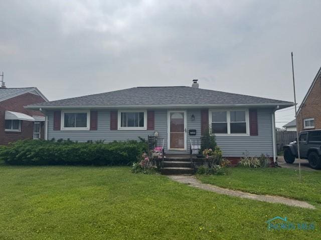 4509 286th St, Toledo, OH 43611 - view of front of house with a front lawn and roof with shingles