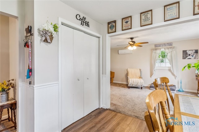 8399 W State Route 12, Fostoria, OH 44830 - living area with ceiling fan, wood finished floors, and a wall mounted AC