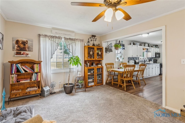 8399 W State Route 12, Fostoria, OH 44830 - living area featuring carpet flooring, ornamental molding, a ceiling fan, and baseboards
