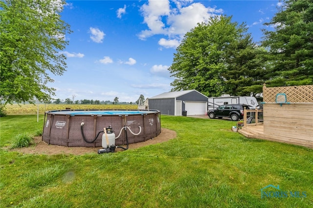 8399 W State Route 12, Fostoria, OH 44830 - view of grassy yard featuring a garage and an outdoor structure