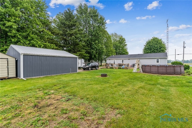 8399 W State Route 12, Fostoria, OH 44830 - view of grassy yard featuring an outdoor pool