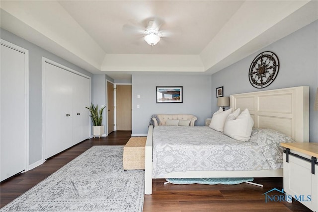 2543 Broadway St Unit 2543, Toledo, OH 43609 - bedroom with a tray ceiling, wood finished floors, a ceiling fan, and baseboards