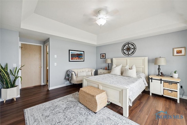 2543 Broadway St Unit 2543, Toledo, OH 43609 - bedroom with a tray ceiling, baseboards, dark wood finished floors, and a ceiling fan