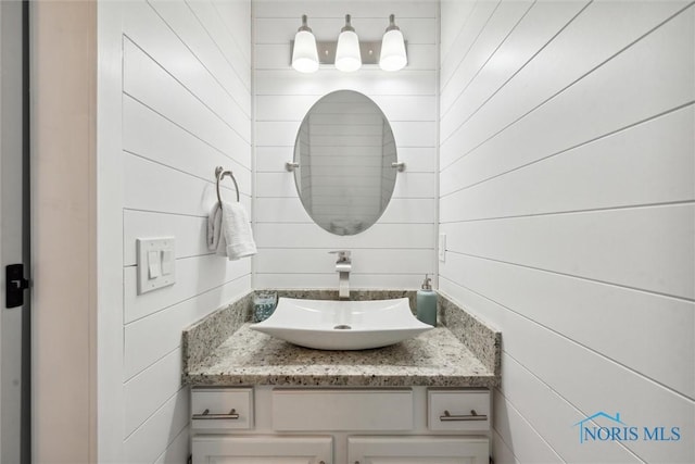 2543 Broadway St Unit 2543, Toledo, OH 43609 - bathroom with vanity and wood walls