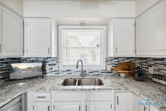 2543 Broadway St Unit 2543, Toledo, OH 43609 - kitchen with a sink, white cabinetry, and decorative backsplash