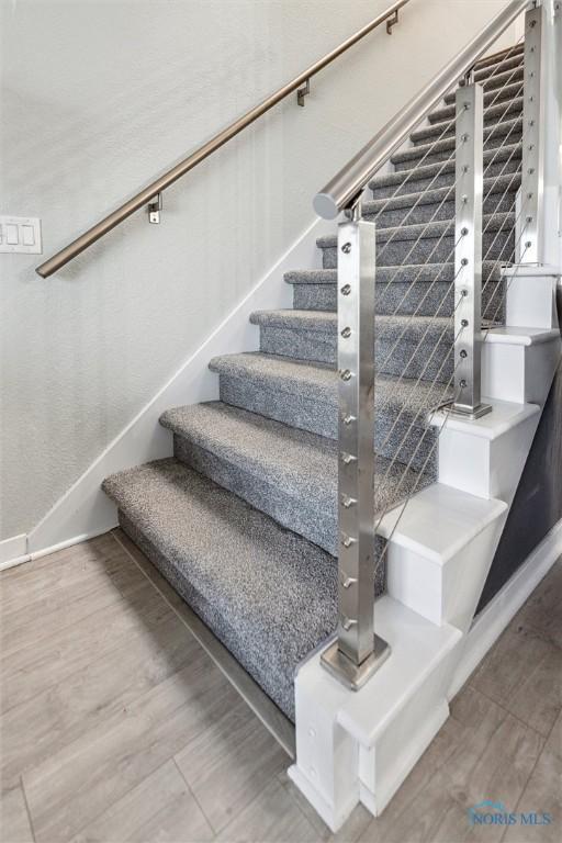 2543 Broadway St Unit 2543, Toledo, OH 43609 - stairway with baseboards and wood finished floors