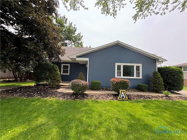 803 W Holland St, Archbold, OH 43502 - view of front of house with a front lawn