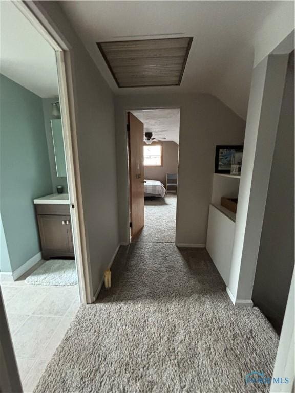 803 W Holland St, Archbold, OH 43502 - corridor featuring vaulted ceiling, light colored carpet, and baseboards