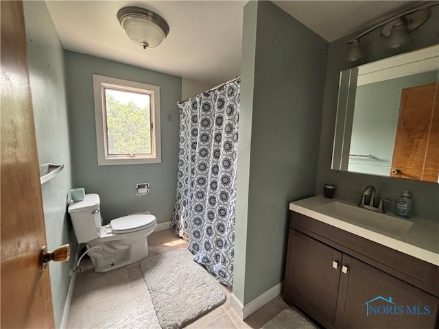 803 W Holland St, Archbold, OH 43502 - bathroom with toilet, vanity, baseboards, and a shower with curtain