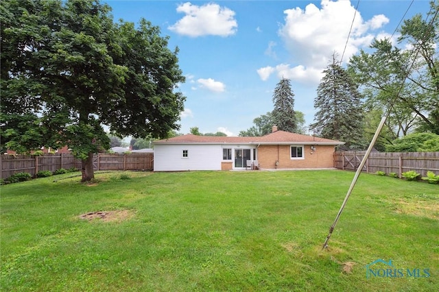 1240 Westgate Rd, Toledo, OH 43615 - rear view of property featuring a chimney and brick siding