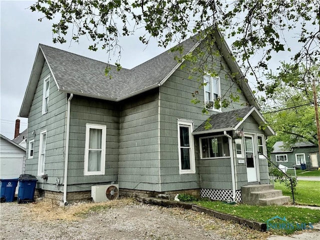335 N Cherry St, Bryan, OH 43506 - view of side of home with entry steps and roof with shingles