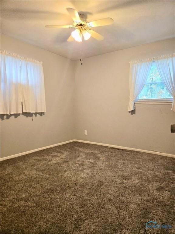 308 Jackson St, Delta, OH 43515 - spare room featuring ceiling fan, carpet, and baseboards