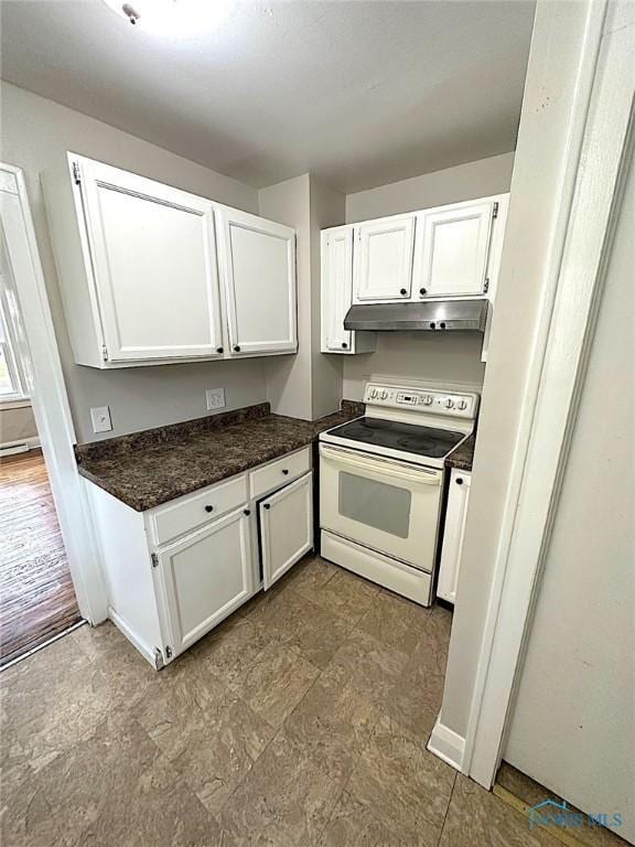 1739 Wyndhurst Rd, Toledo, OH 43607 - kitchen featuring white range with electric stovetop, under cabinet range hood, white cabinetry, and dark countertops