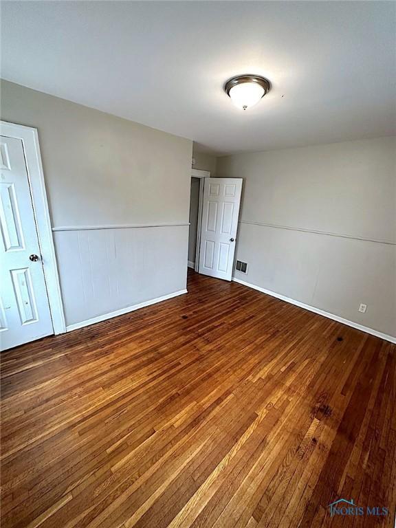 1739 Wyndhurst Rd, Toledo, OH 43607 - unfurnished room featuring hardwood / wood-style floors and baseboards