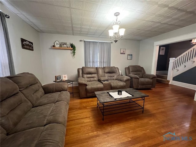 430 W Johnson St, Upper Sandusky, OH 43351 - living area featuring a chandelier, wood finished floors, stairs, and baseboards