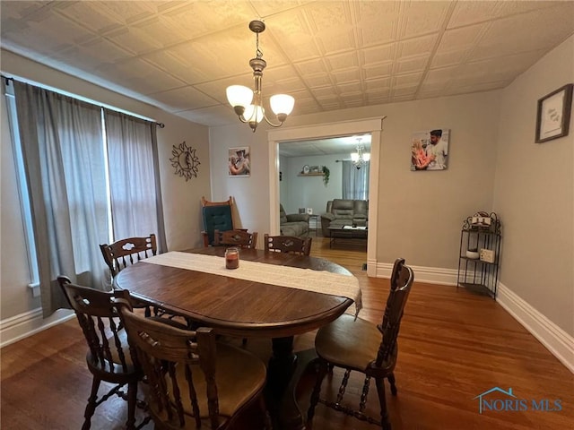 430 W Johnson St, Upper Sandusky, OH 43351 - dining room with a chandelier, wood finished floors, and baseboards
