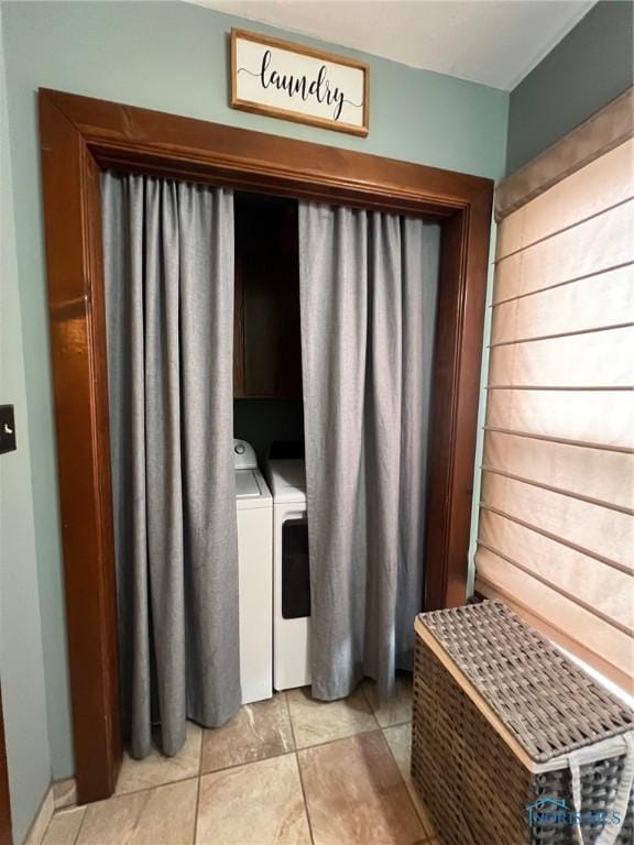 430 W Johnson St, Upper Sandusky, OH 43351 - laundry room featuring washer and dryer, cabinet space, and light tile patterned floors