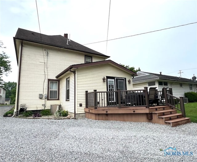 430 W Johnson St, Upper Sandusky, OH 43351 - rear view of property featuring a wooden deck and central AC