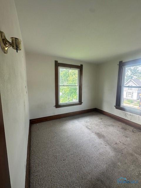 831 Oak St, Toledo, OH 43605 - empty room featuring baseboards and carpet floors