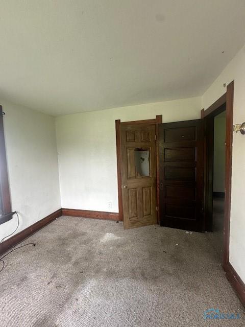 831 Oak St, Toledo, OH 43605 - empty room featuring carpet and baseboards