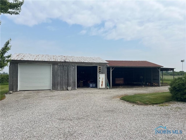 2546 State Route 66, Cloverdale, OH 45827 - garage with driveway and a garage
