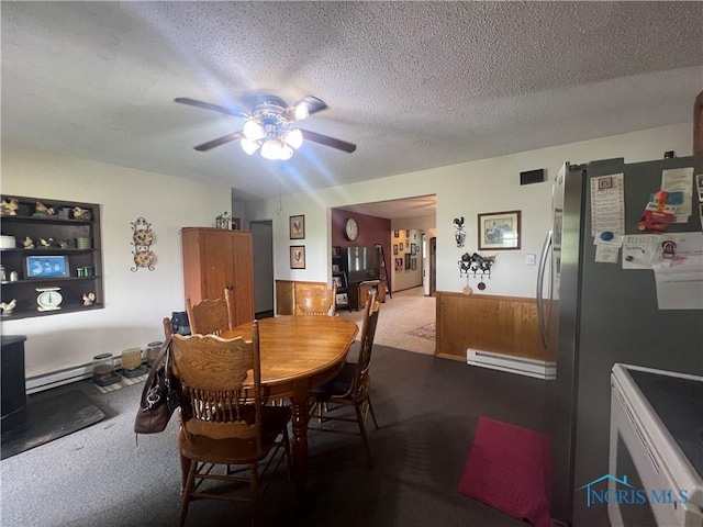 2546 State Route 66, Cloverdale, OH 45827 - carpeted dining room featuring baseboard heating, a ceiling fan, and a textured ceiling