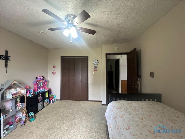 2546 State Route 66, Cloverdale, OH 45827 - carpeted bedroom featuring a closet, a textured ceiling, and ceiling fan