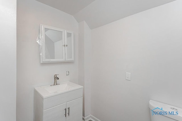 2740 Robinwood Ave, Toledo, OH 43610 - half bath featuring vanity and lofted ceiling