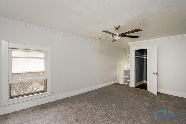 2740 Robinwood Ave, Toledo, OH 43610 - unfurnished bedroom with ornamental molding, carpet, ceiling fan, and a closet
