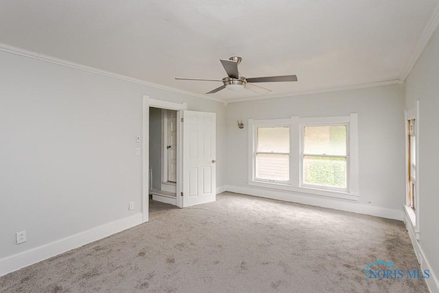 2740 Robinwood Ave, Toledo, OH 43610 - empty room with crown molding, carpet floors, and ceiling fan