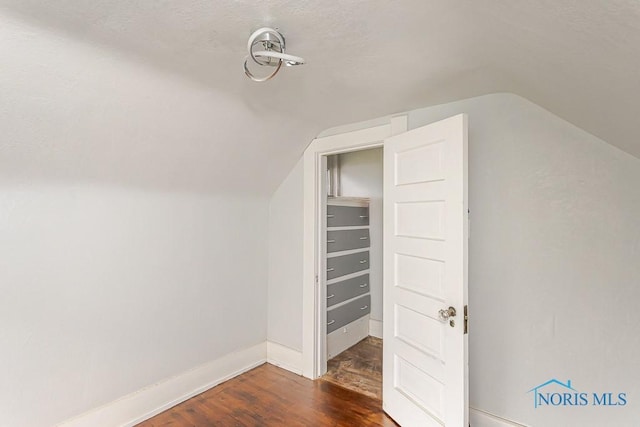2740 Robinwood Ave, Toledo, OH 43610 - additional living space with vaulted ceiling and dark wood-style floors