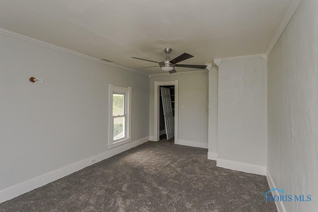 2740 Robinwood Ave, Toledo, OH 43610 - empty room featuring dark colored carpet, crown molding, and a ceiling fan