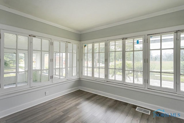 2740 Robinwood Ave, Toledo, OH 43610 - unfurnished sunroom with healthy amount of natural light, wood finished floors, french doors, and ornamental molding