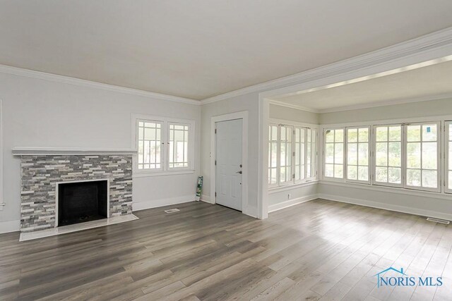 2740 Robinwood Ave, Toledo, OH 43610 - unfurnished living room with wood finished floors, a fireplace with flush hearth, and crown molding