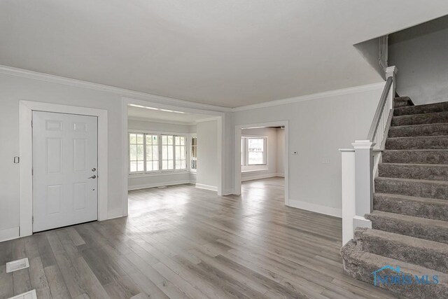 2740 Robinwood Ave, Toledo, OH 43610 - foyer entrance featuring crown molding, stairway, and wood finished floors