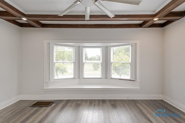 2740 Robinwood Ave, Toledo, OH 43610 - spare room featuring coffered ceiling, healthy amount of natural light, beamed ceiling, ceiling fan, and wood finished floors
