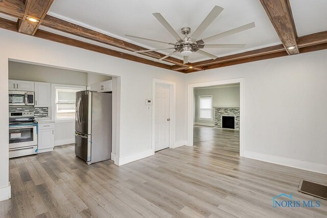 2740 Robinwood Ave, Toledo, OH 43610 - kitchen with stainless steel appliances, coffered ceiling, a ceiling fan, beamed ceiling, and light wood-style floors