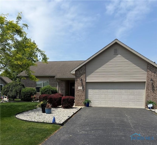 276 E Winter Woods Dr, Findlay, OH 45840 - single story home with brick siding, driveway, a garage, and a front lawn