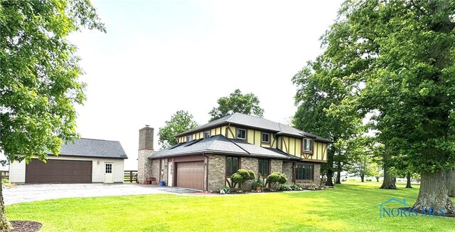 534 S Butternut St, Deshler, OH 43516 - view of front of home featuring a front lawn and brick siding