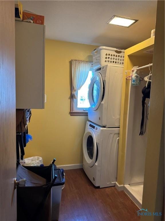 534 S Butternut St, Deshler, OH 43516 - laundry room featuring stacked washer / drying machine and wood finished floors
