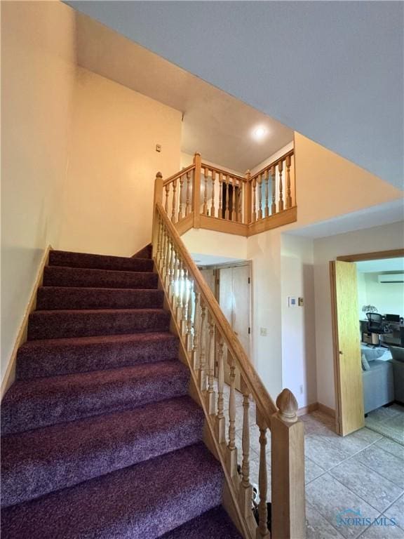 534 S Butternut St, Deshler, OH 43516 - staircase with a wall unit AC, tile patterned floors, and recessed lighting