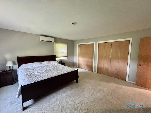 534 S Butternut St, Deshler, OH 43516 - carpeted bedroom with a wall mounted air conditioner and multiple closets