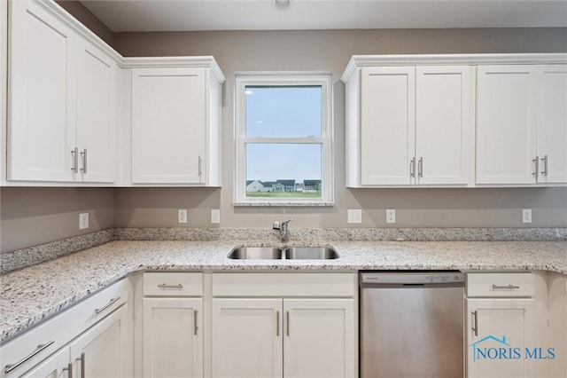8805 Birchfield Rd, Sylvania, OH 43560 - kitchen featuring stainless steel dishwasher, a sink, white cabinetry, and light stone countertops